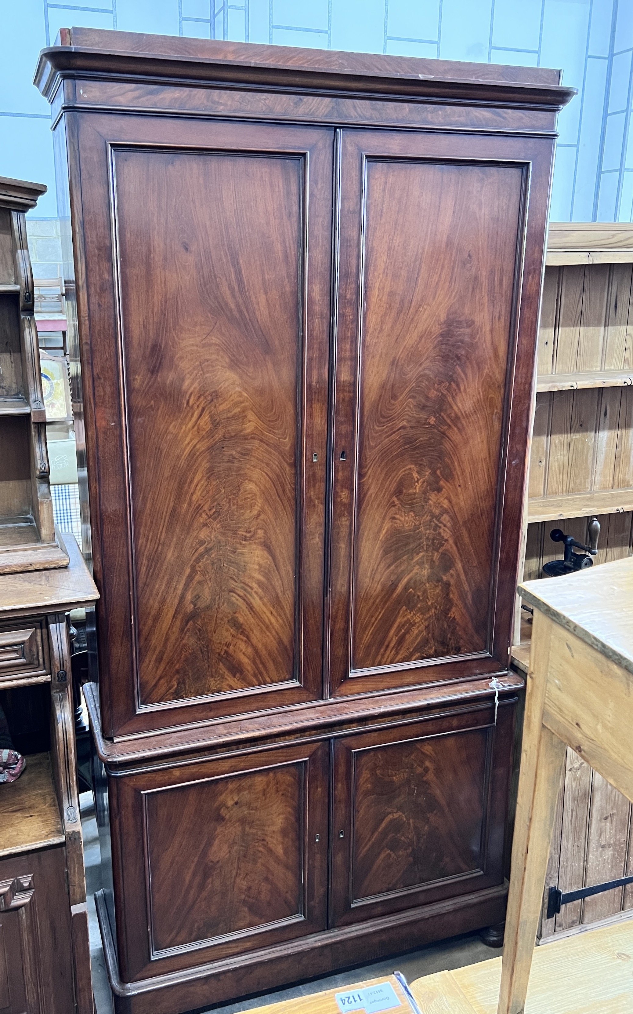 A Victorian mahogany library bookcase cupboard, width 110cm, depth 39cm, height 222cm